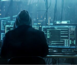dangerous-hooded-hacker-breaks-into-government-data-servers-and-a-picture-id817486228-1
