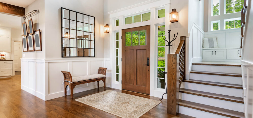 Foyer of a nice home with a wooden door