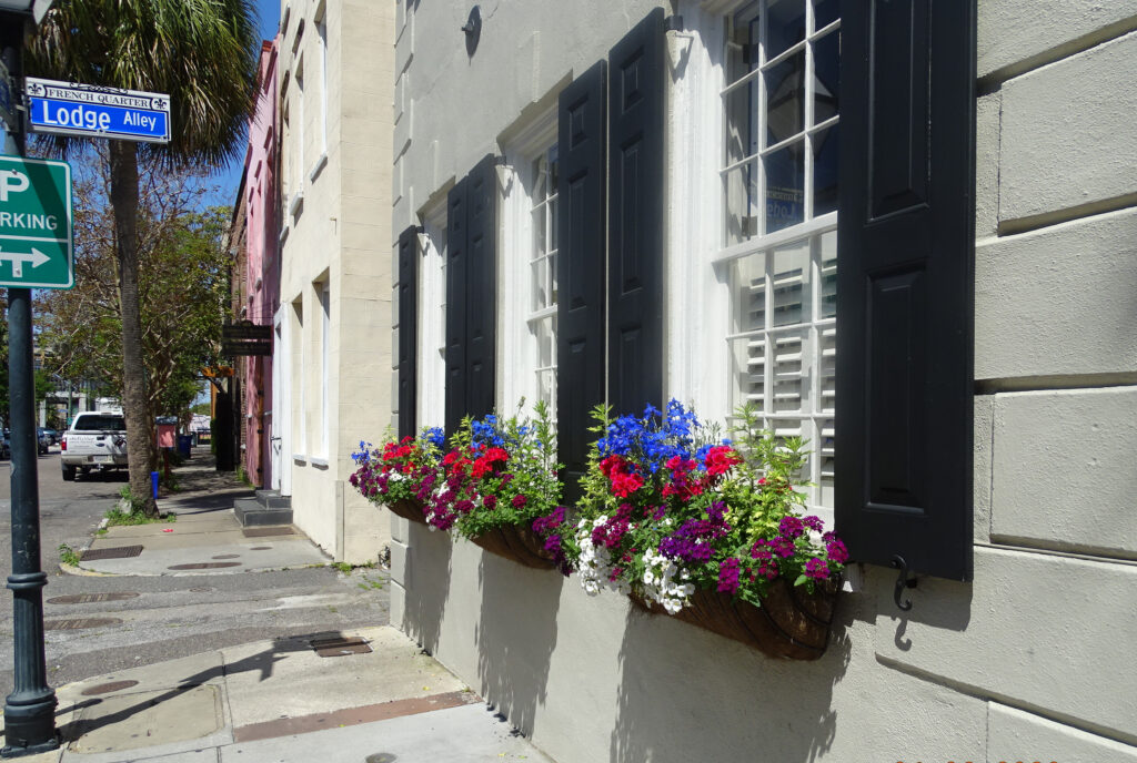 Flowers in window boxes at Lodge Alley in the French Quarter of Charleston